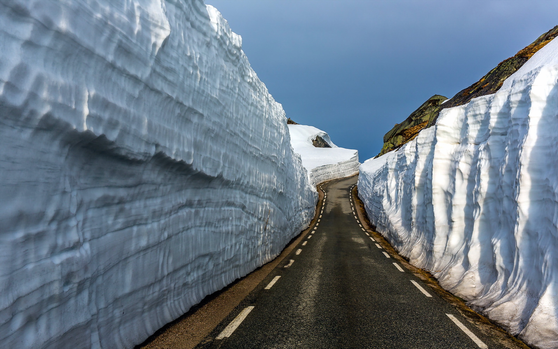 An highway between two icy hills.